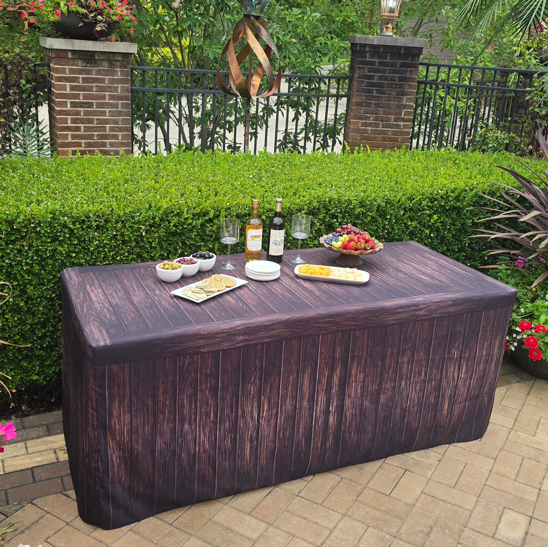 Fabric fitted table cover for elegant outdoor event.