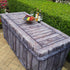 Side picture of a 6ft folding lifetime table covered with a gorgeous fitted fabric table cover that looks like real wood. On top is charcuterie food, wine and glasses for an outdoor special event.