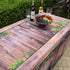 Fabric fitted table cover with a botanical rustic oak faux wood look design for folding tables at events.