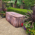 Rustic Wood Fabric Fitted Table Cover over a plastic folding table at a resort used for outdoor parties and events.