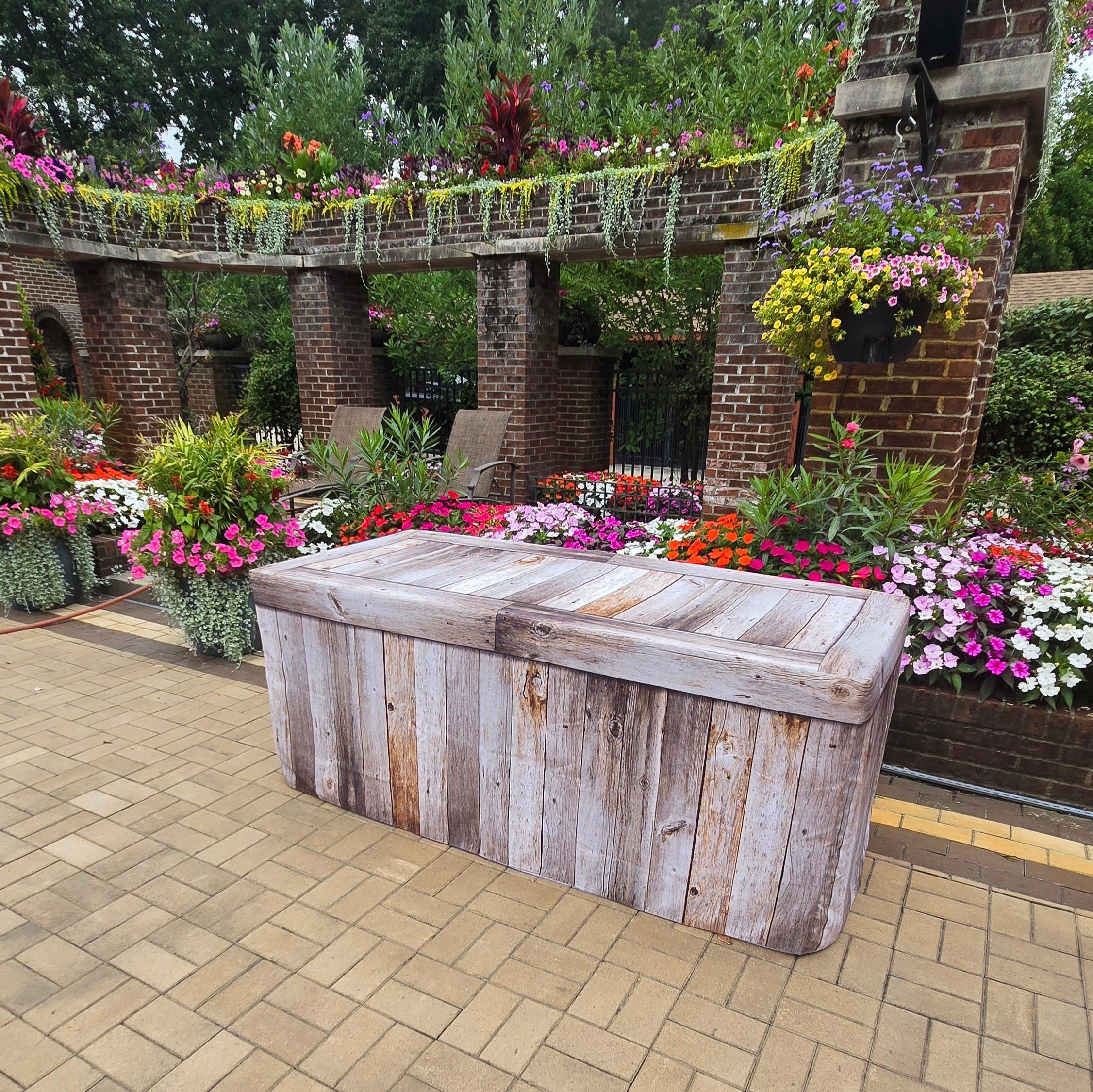 Fabric Fitted Table Cover with a faux Weathered Wood Design used on a plastic folding table for special events.