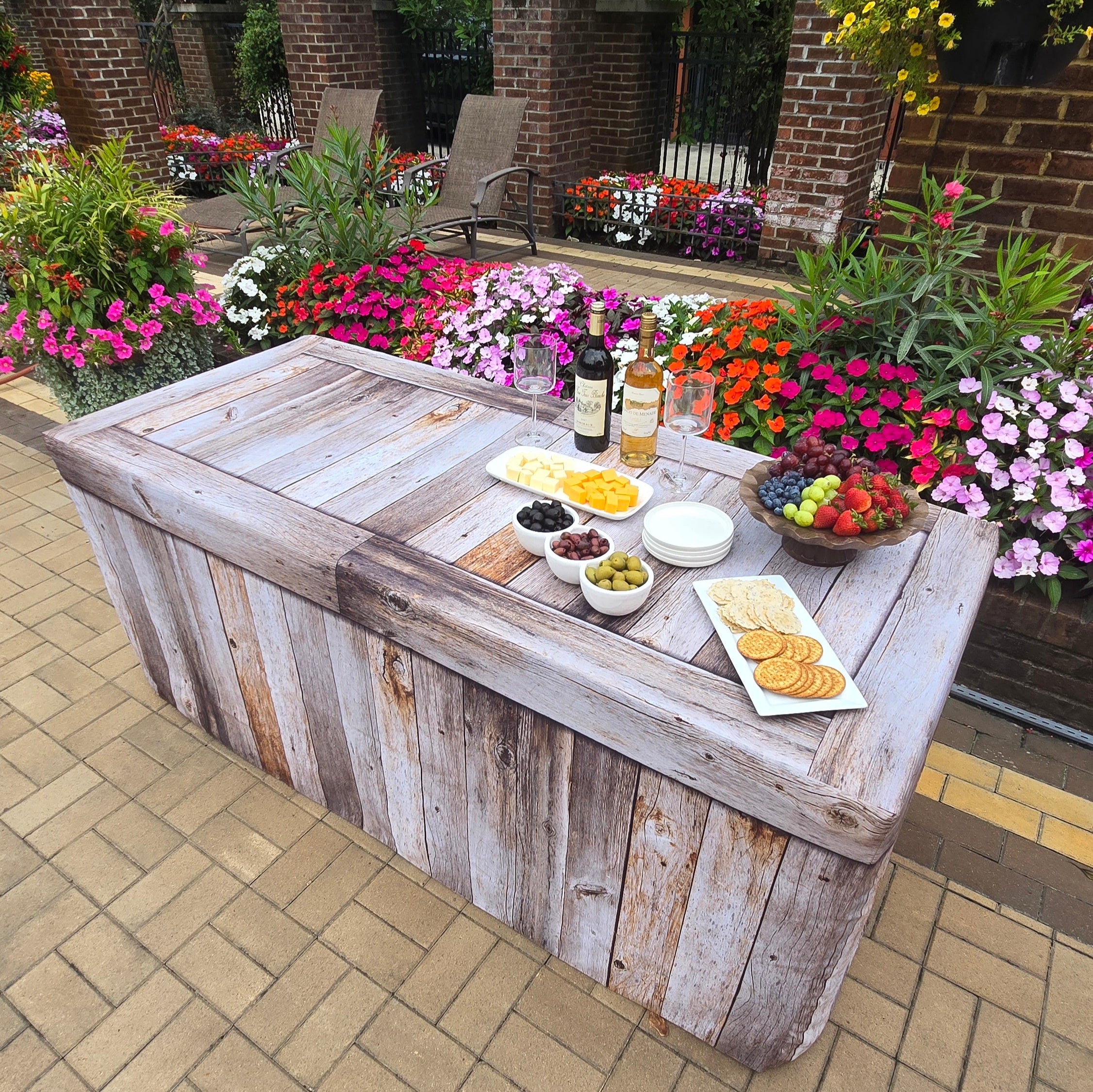 6ft rectangle table with a fitted fabric table cover that is custom printed to look like real wood. Use for events.