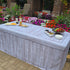 6FT table cover with a faux wood look table cover at an outdoor event with charcuterie and catered food.